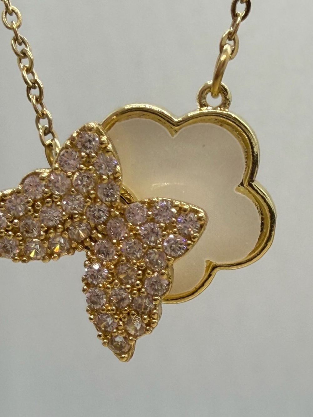 Spinning Gold-Tone Flower Pendant Necklace with Pink Crystal Accents